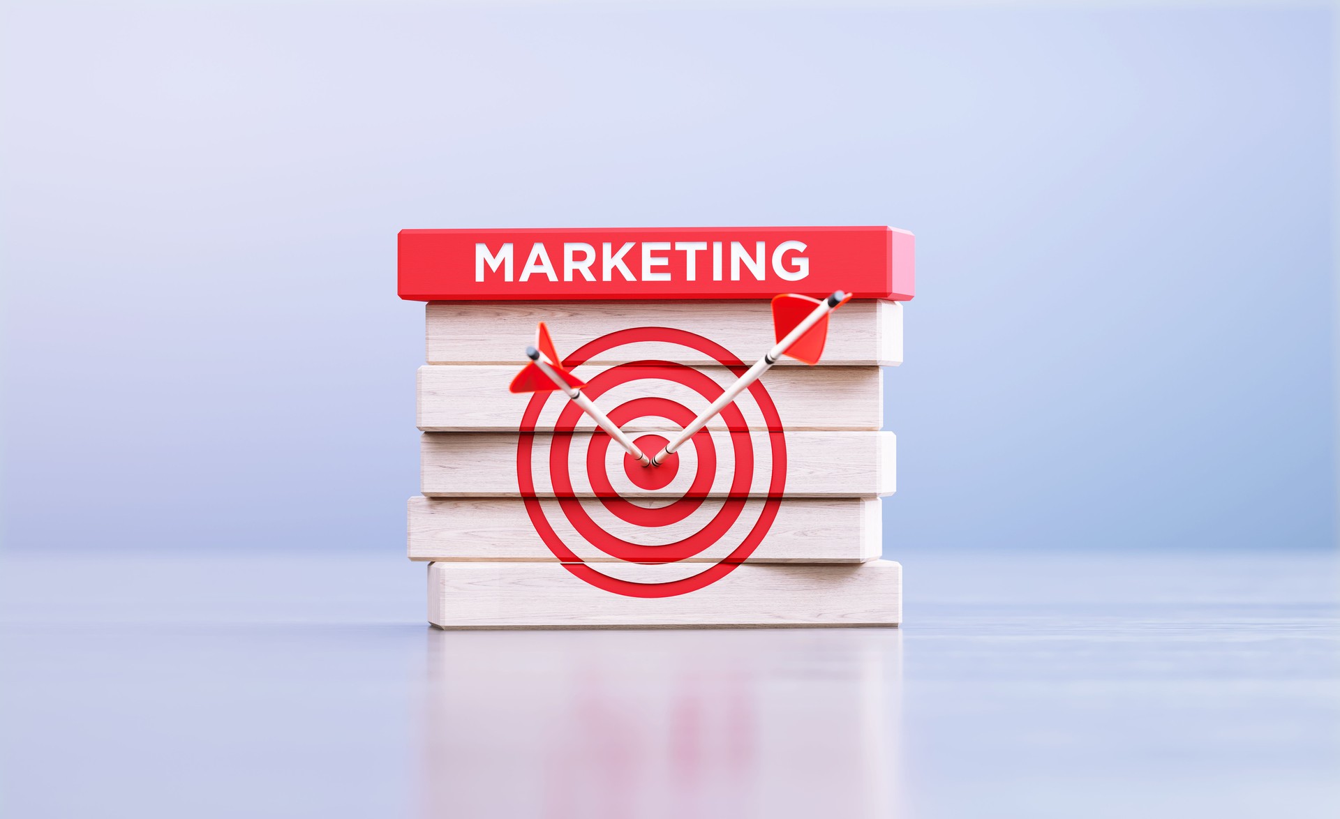 Marketing Concept - Arrows Hitting Bull's Eye Target Symbol And The Marketing Word Written Wood Blocks In Front Defocused Background